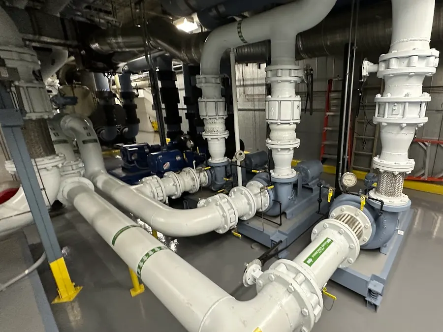 Chilled water pumps and welded steel headers in the plant room